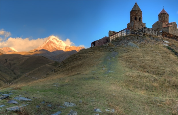 Third largest in Georgia, Mount Kazbek towers over the 14th century church of Tsminda Sameba. Photo credit: James Carnehan