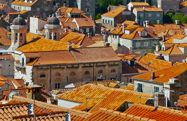 Newer tiles (yellow-orange) attempt to blend in with older, original terracotta red tiles that distinguish Dubrovnik's renowned roofs. Photo credit: Martin Klimenta