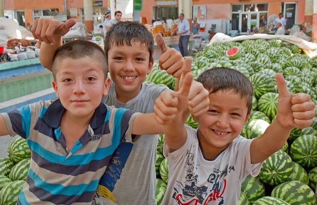 Young boys offer a warm welcome to Khujand’s Panjshanbe Bazaar.  Photo credit: Richard Fejfar