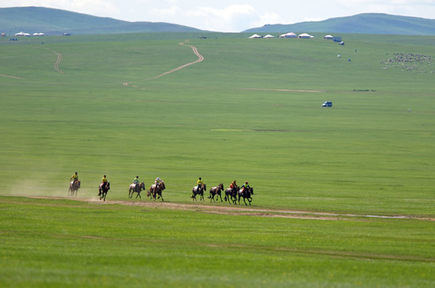 Horse racing at a local Naadam Festival. Photo credit: Helge Pedersen
