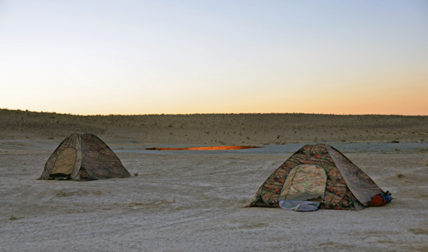 The campfire never goes out for tenters at Turkmenistan’s Darvaza Gas Crater. Photo credit: Russ Cmolik & Ellen Cmolik