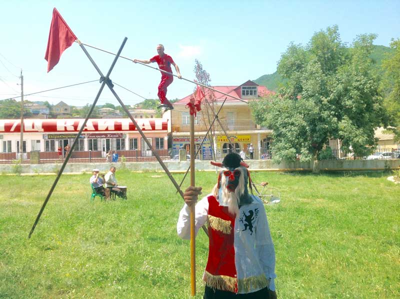 Daring young men on a tightrope in Majalis, North Caucasus. Photo credit: Michel Behar
