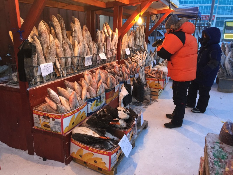 Winter fashion on display at a Yakutsk frozen fish market