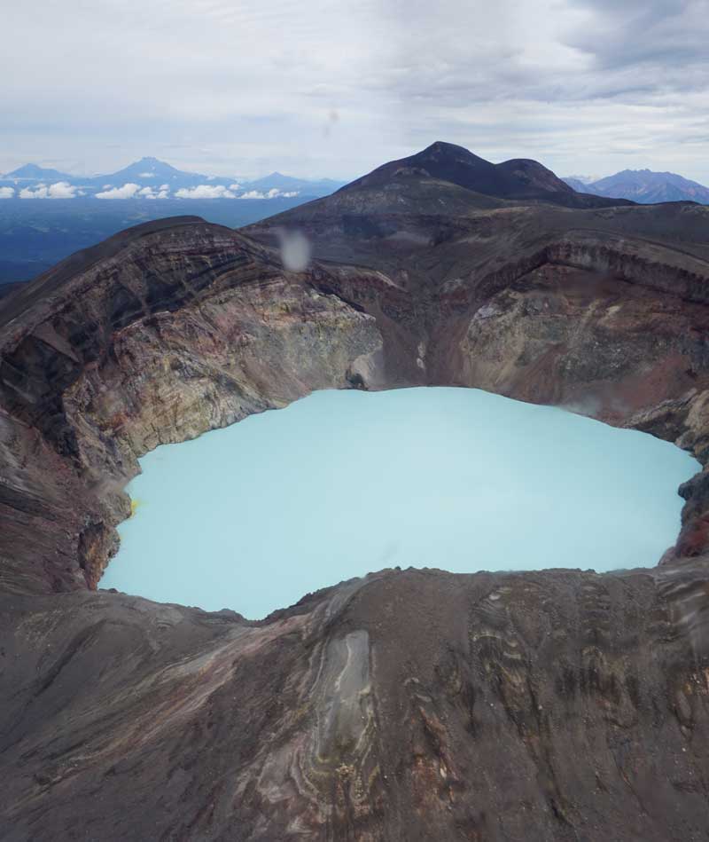 Turquoise lake in a volcano crater en route to Valley of the Geysers, Kamchatka. Photo credit: Jake Smith