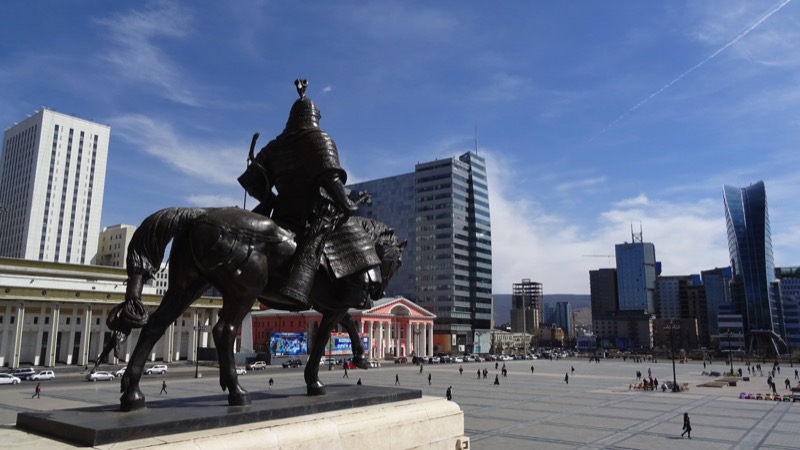 A statue of a Mongol warrior stands guard outside the Parliament Building in Sukhbaatar Square, Ulaanbaatar. Photo credit: Vladimir Kvashnin