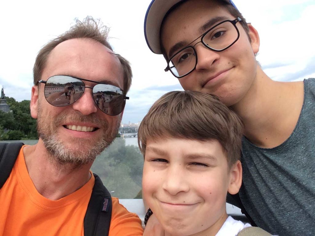 Dmitry spending time with his nephews on Kiev's new glass-bottom pedestrian bridge. Photo credit: Dmitry Rudich